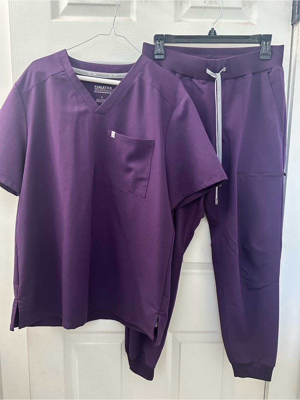 Men's Fabletics athletic scrub set in deep purple